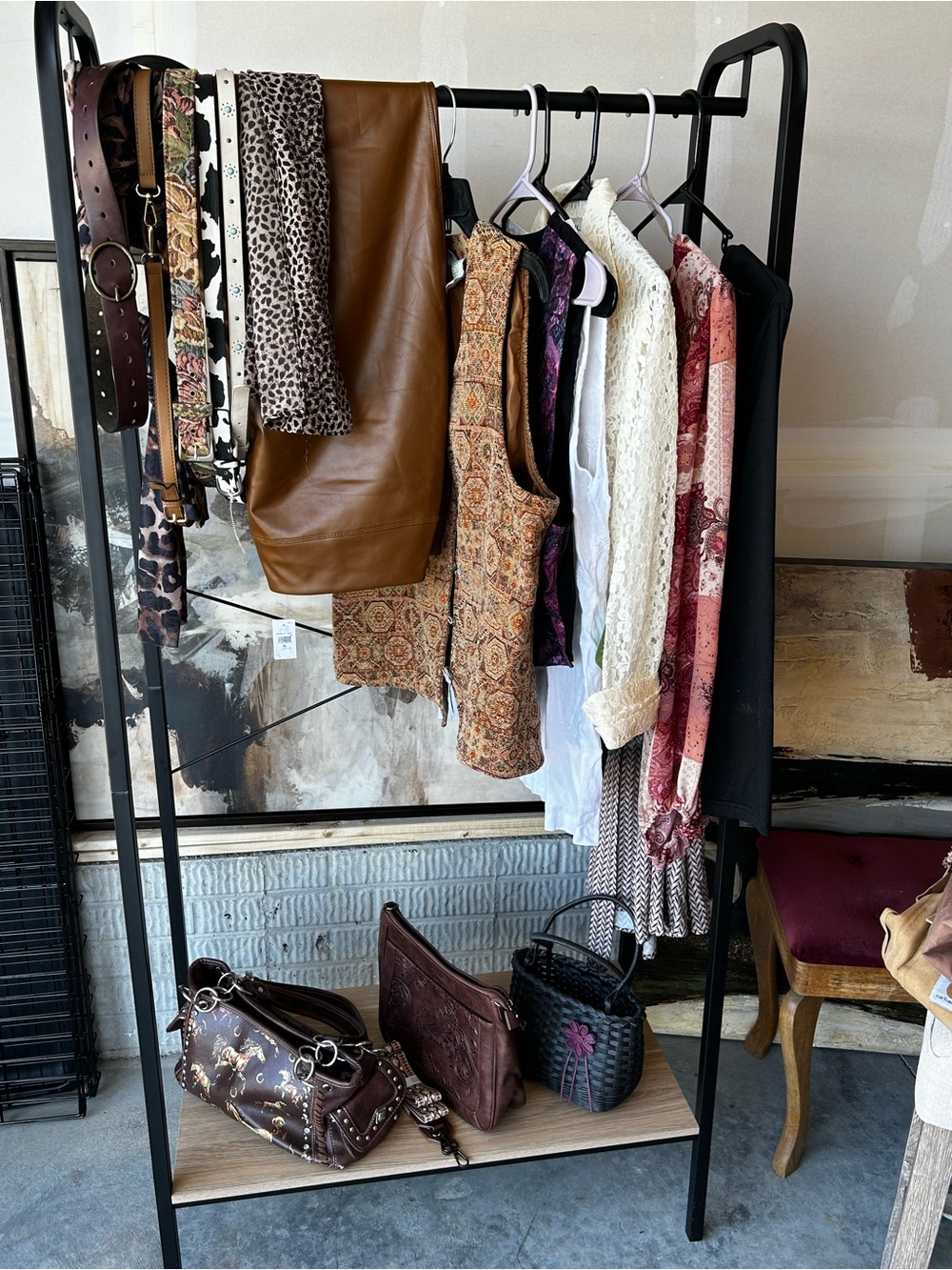 Mixed Boho Clothing Rack with Leather Pants and Patterned Tops